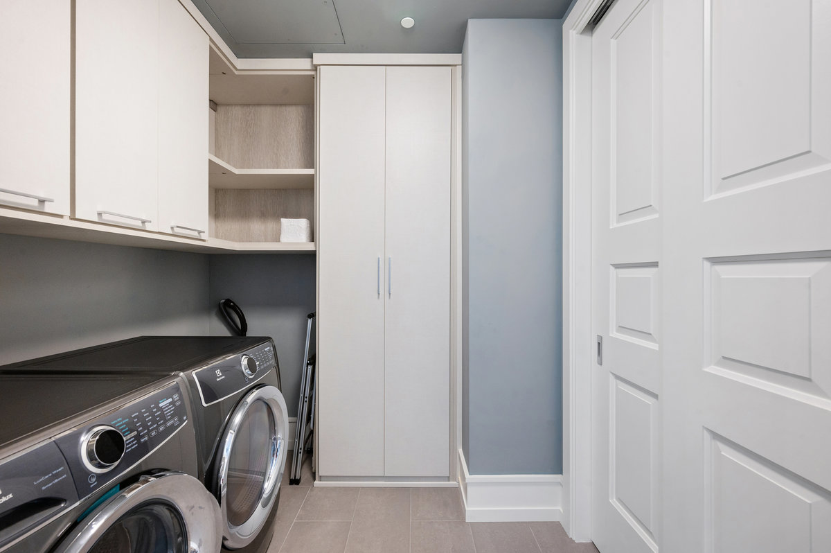 Laundry room/pantry with custom cabinetry